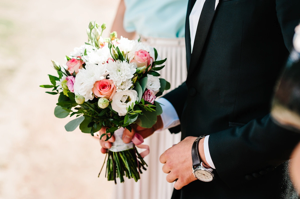 White floral ceremony arch at a Dublin wedding